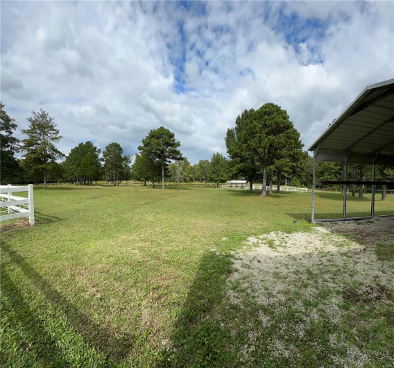 View of yard featuring fence