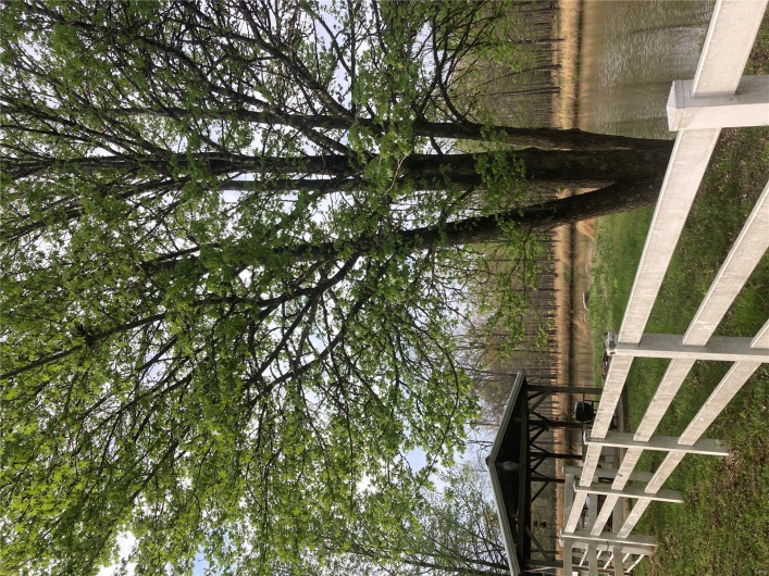 View of yard featuring fence and a water view