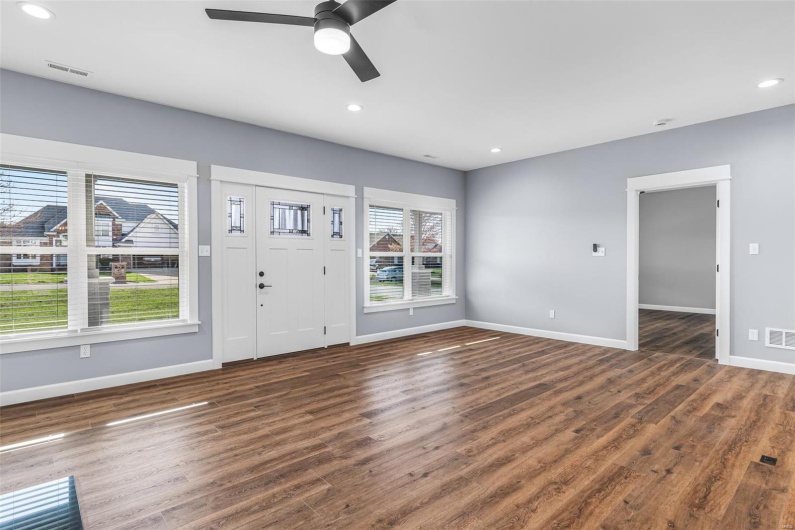 Entryway with baseboards, wood finished floors, recessed lighting, and a ceiling fan