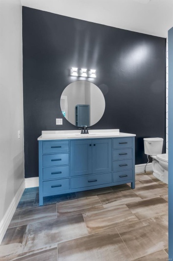 Bathroom with vanity and toilet