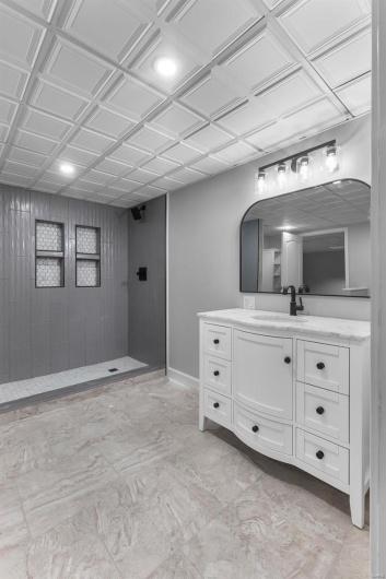 Bathroom with walk in shower and vanity