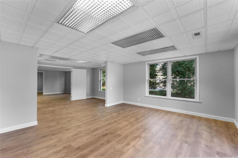 Unfurnished room with light hardwood / wood-style flooring