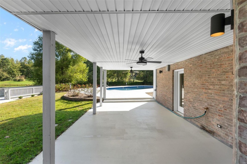 View of patio featuring ceiling fan