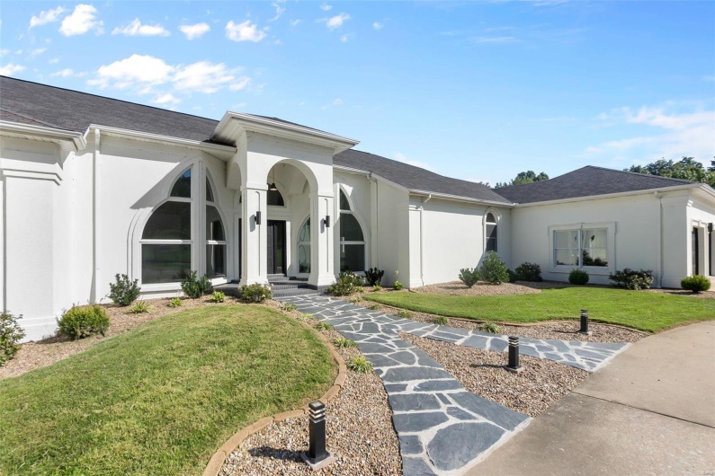 View of front of house with a front lawn