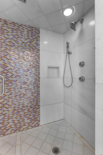 Bathroom featuring walk in shower