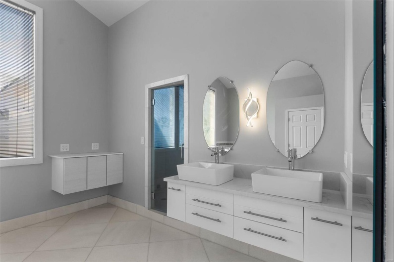 Bathroom featuring tile patterned floors and vanity
