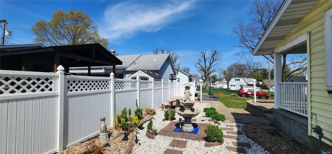 View of yard with a residential view and fence