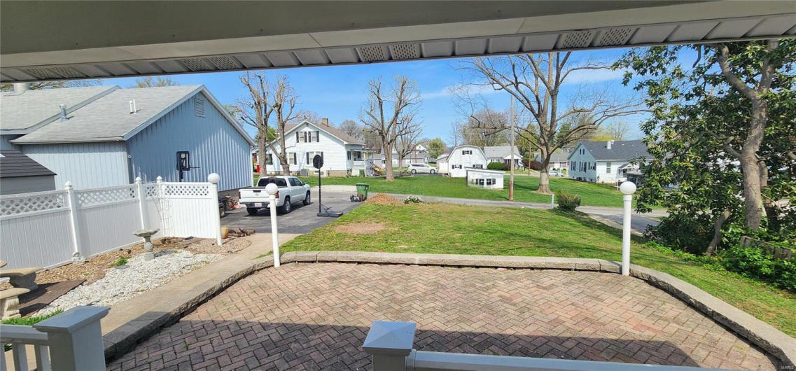 View of patio / terrace with a residential view and fence