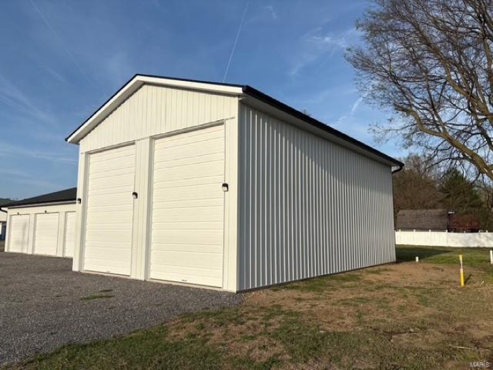 View of outbuilding with an outdoor structure