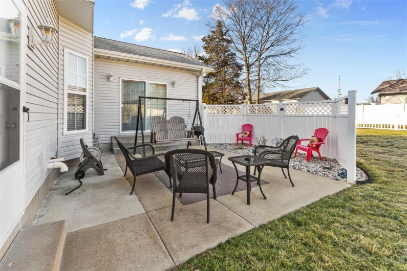 View of patio with fence