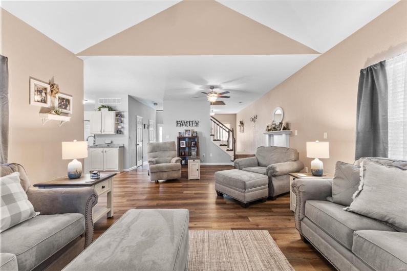 Living area featuring lofted ceiling