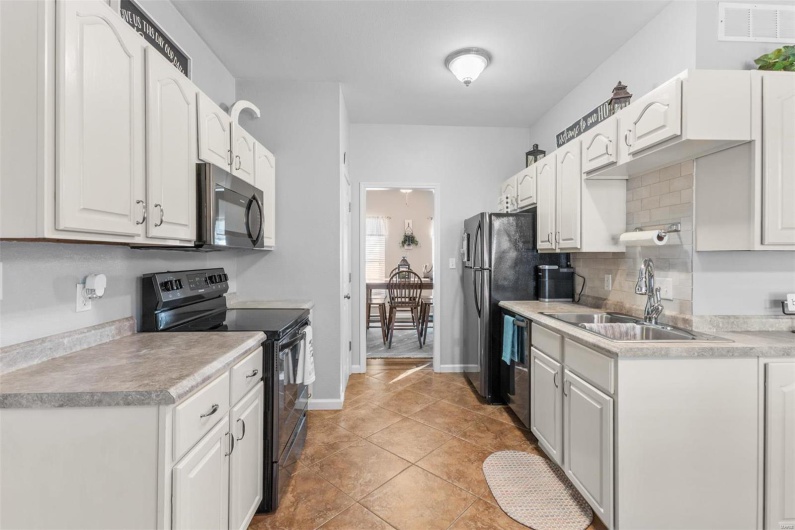 Kitchen. Electric stove has gas hook up capabilities.