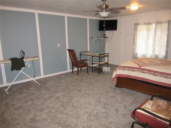 Bedroom with carpet flooring
