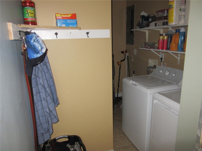 Clothes washing area with independent washer and dryer, laundry area, and electric panel