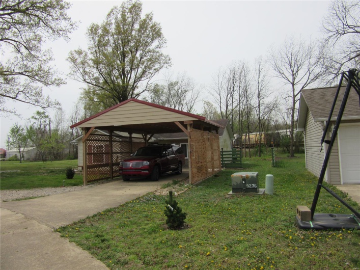 View of car parking featuring concrete driveway