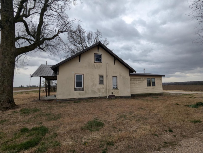 Back of house with stucco siding