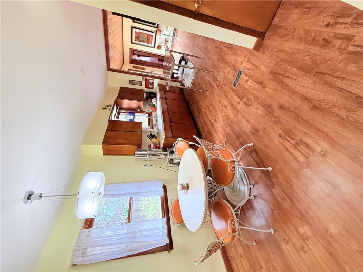 Dining area with baseboards and light wood-type flooring