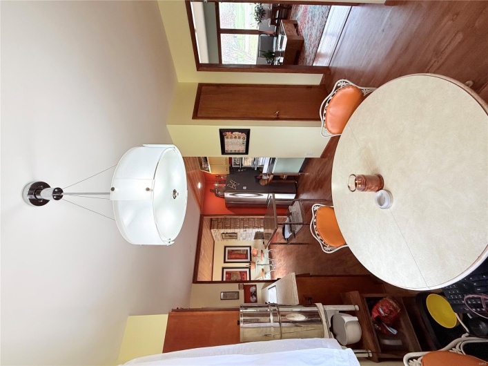 Dining room featuring dark wood-style floors