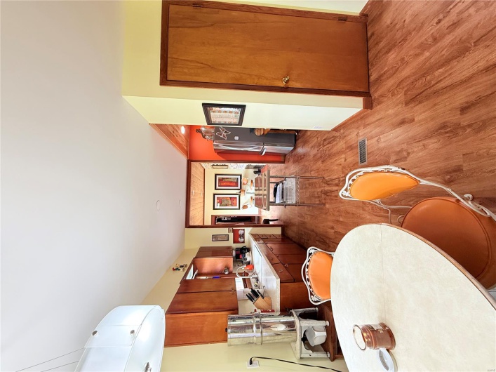 Dining room featuring baseboards, light wood-style floors, and visible vents