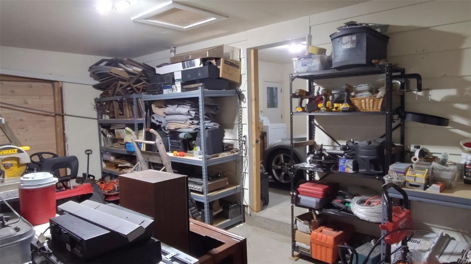Storage area with washer / clothes dryer and attic access