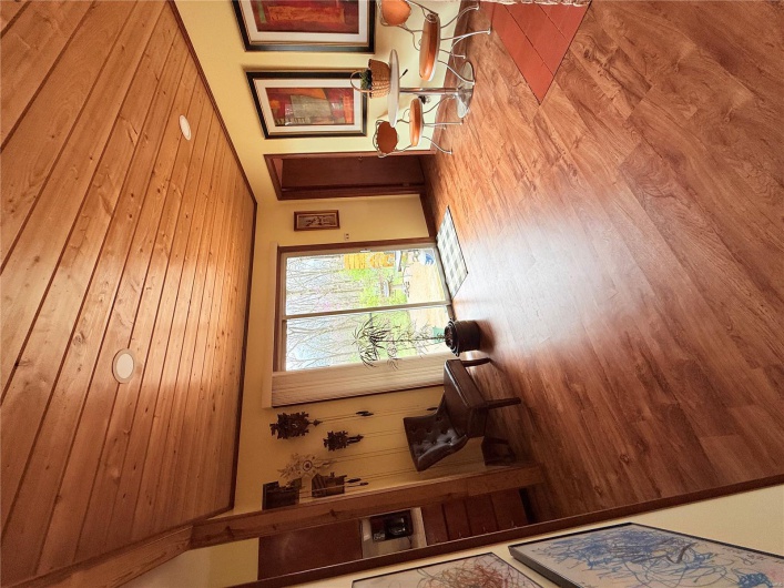 Unfurnished room with light wood finished floors and wood ceiling
