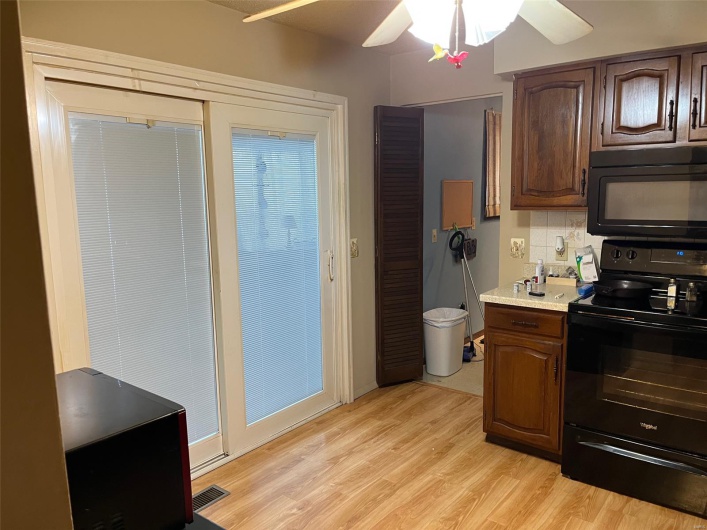 French doors leading to the sunroom. Side door leads to laundry room/garage.