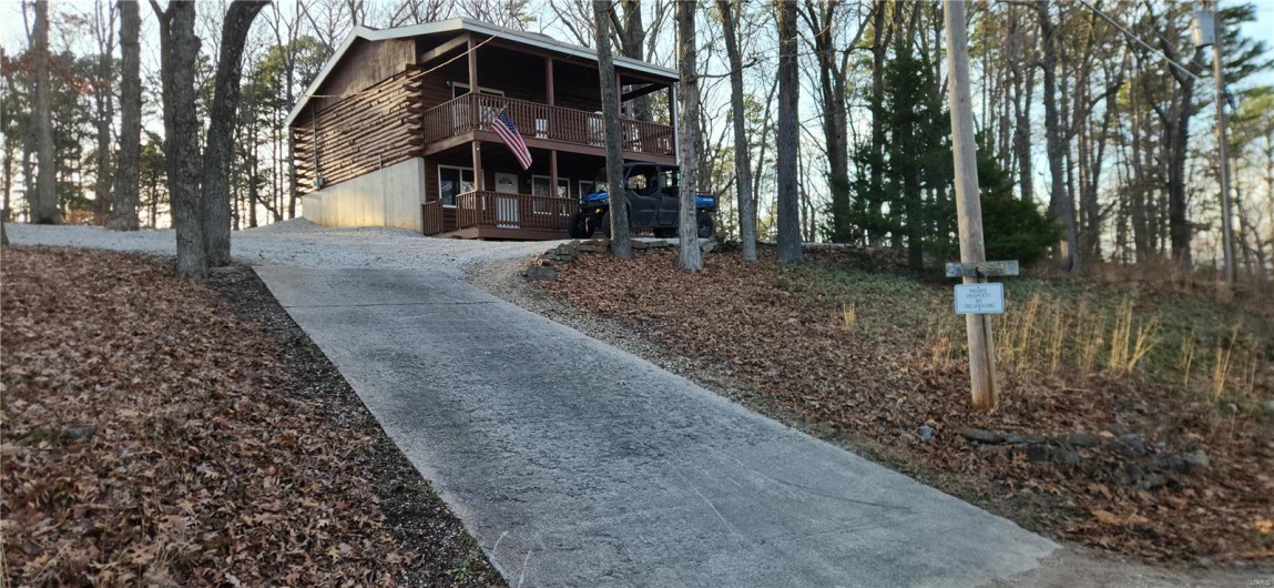 Concrete driveway to crushed stone upper