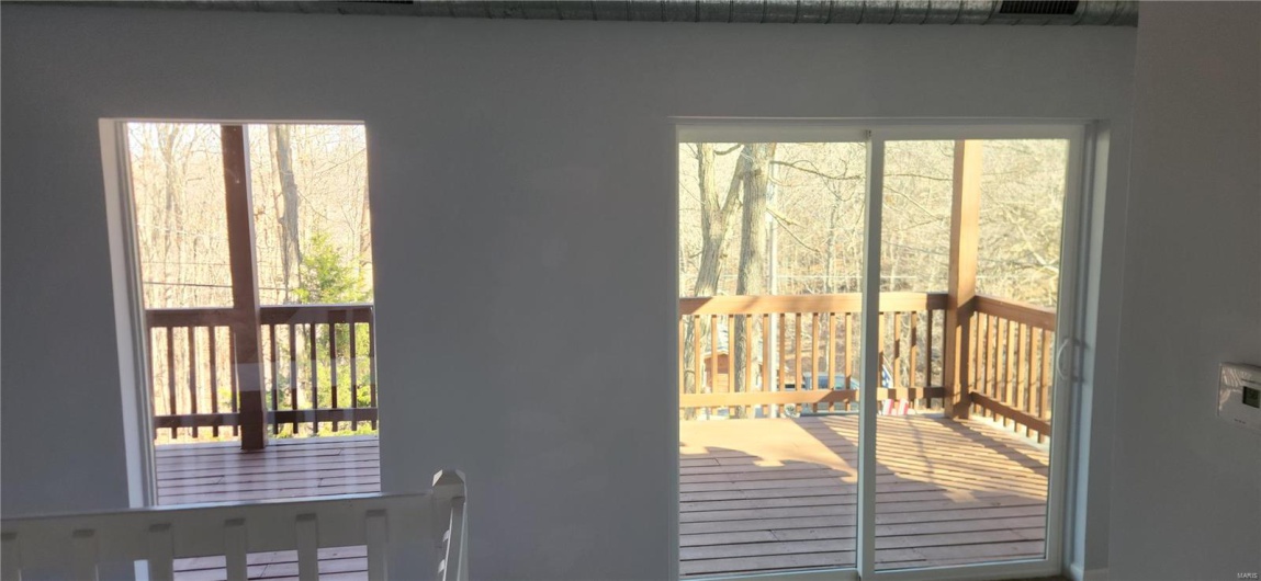 Sliding glass door to upper deck