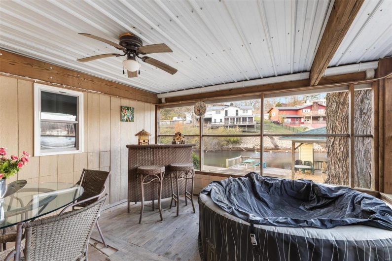 Sunroom / solarium with wood ceiling, ceiling fan, and a healthy amount of sunlight