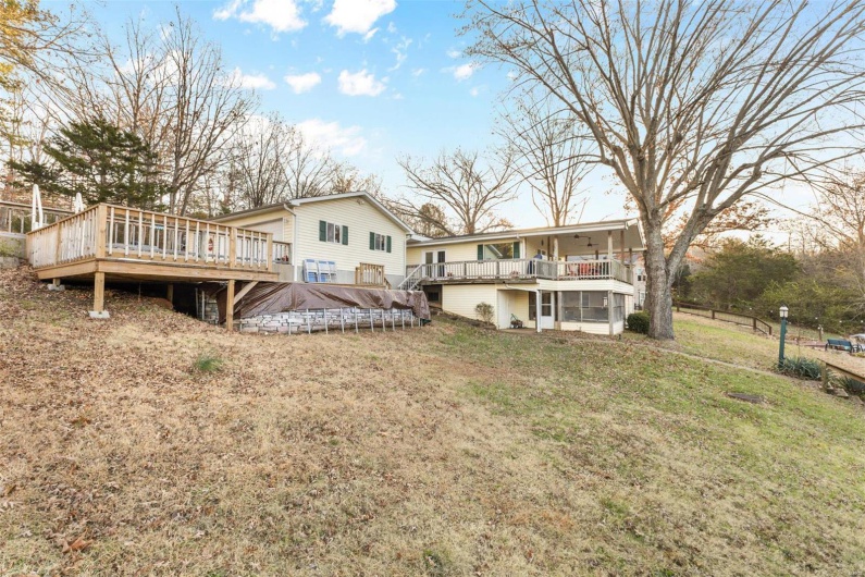Back of property with a wooden deck