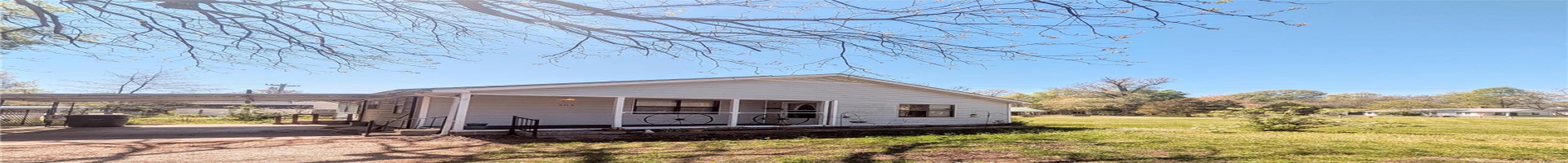 Residential For Sale Bungalow-style home with a front yard, covered porch, and an attached carport