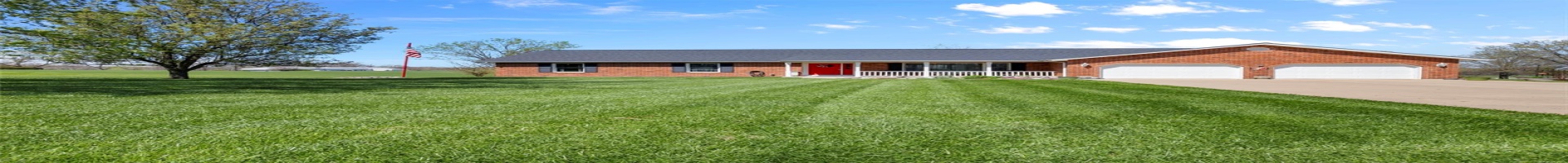 Residential For Sale Single story home featuring a porch, an attached garage, driveway, and a front yard