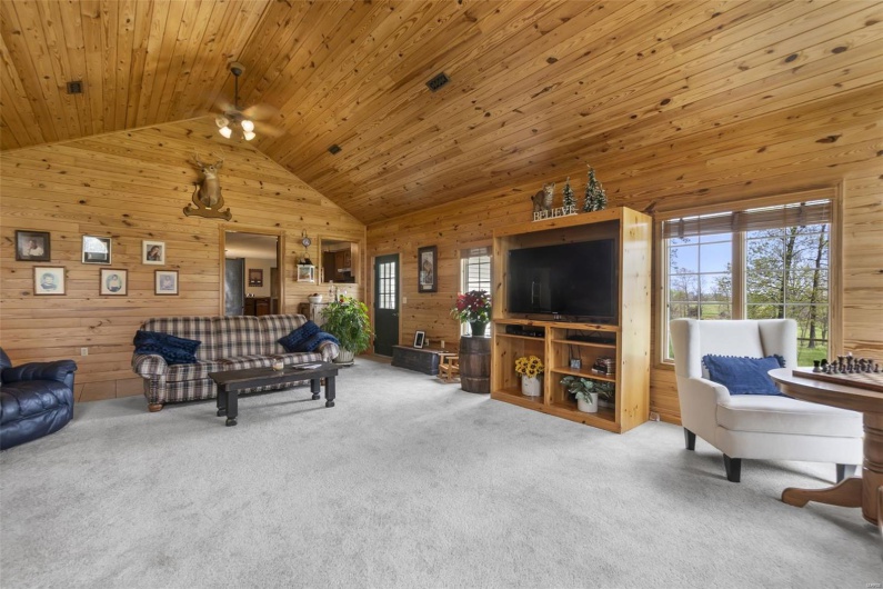  New addition in 2002, stone fireplace, wood walls, wood ceiling, and high vaulted ceiling.