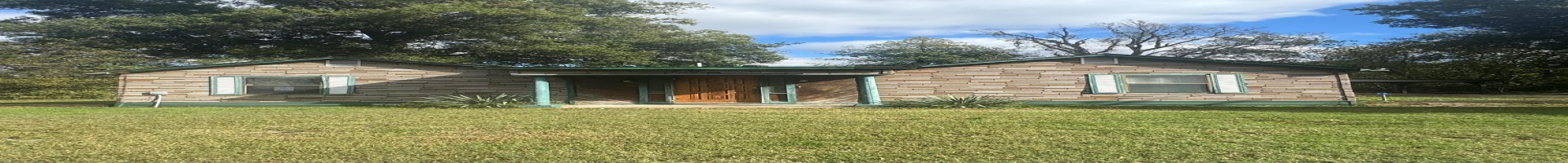 Residential For Sale Rear view of property featuring a yard and a carport