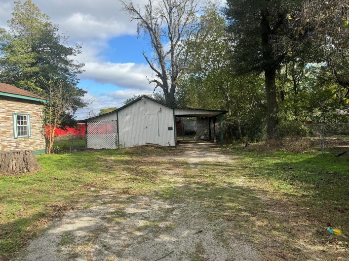 View of yard with a carport