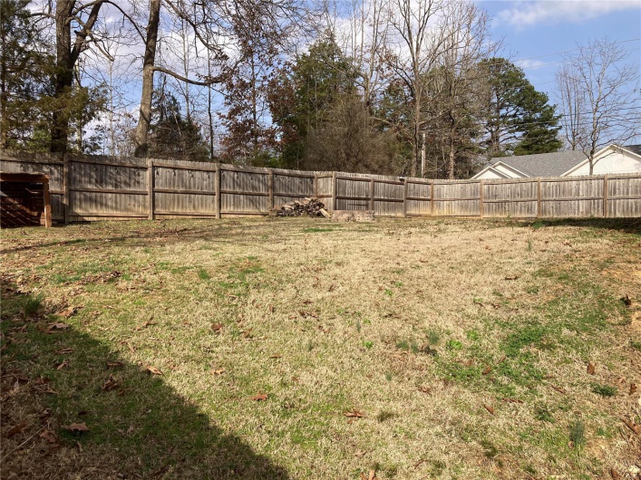 View of yard featuring fence