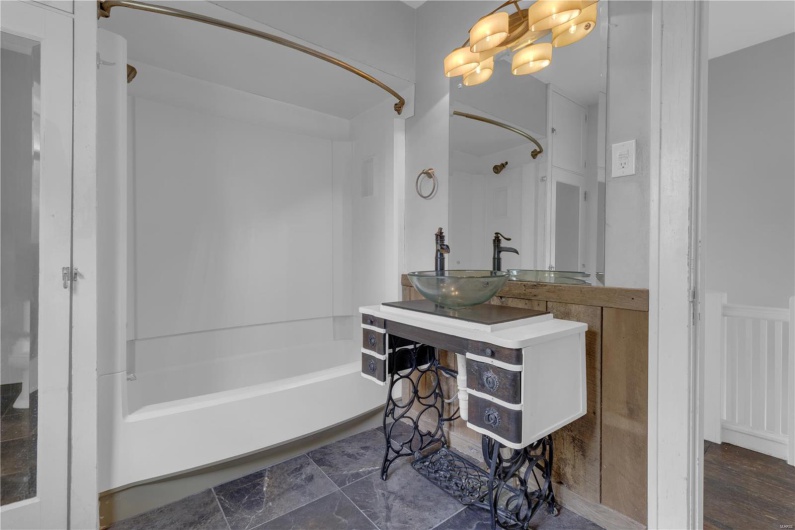 Full bath with shower / tub combination and vanity