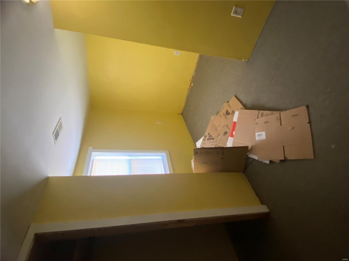 Unfurnished bedroom with visible vents and carpet flooring