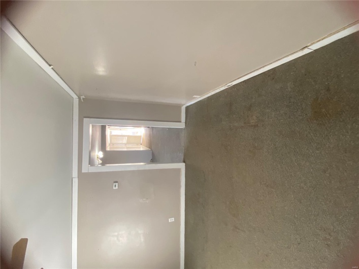 Unfurnished room with carpet floors, baseboards, and a ceiling fan