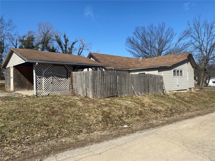 View of home's exterior featuring fence