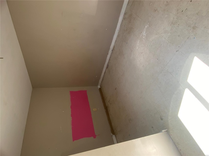 Unfurnished room with baseboards