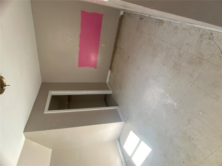 Unfurnished bedroom with a closet and baseboards