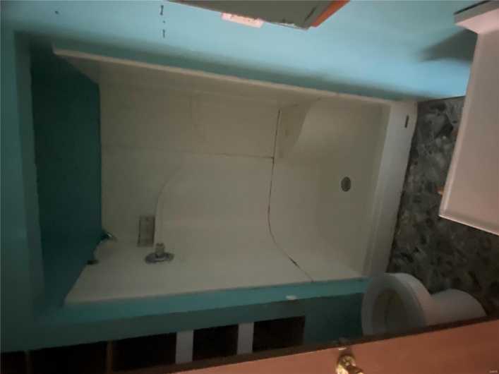 Bathroom featuring a shower and toilet