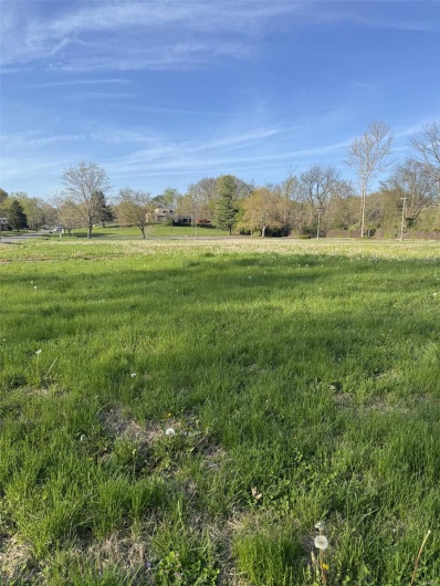 View of yard with a rural view