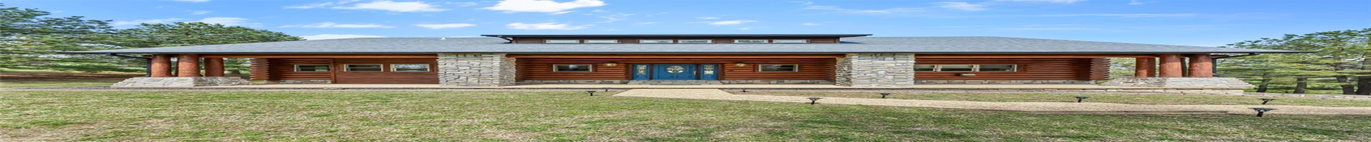 Residential For Sale Front of Rocky Mtn Log Home with Expansive Covered Front Porch