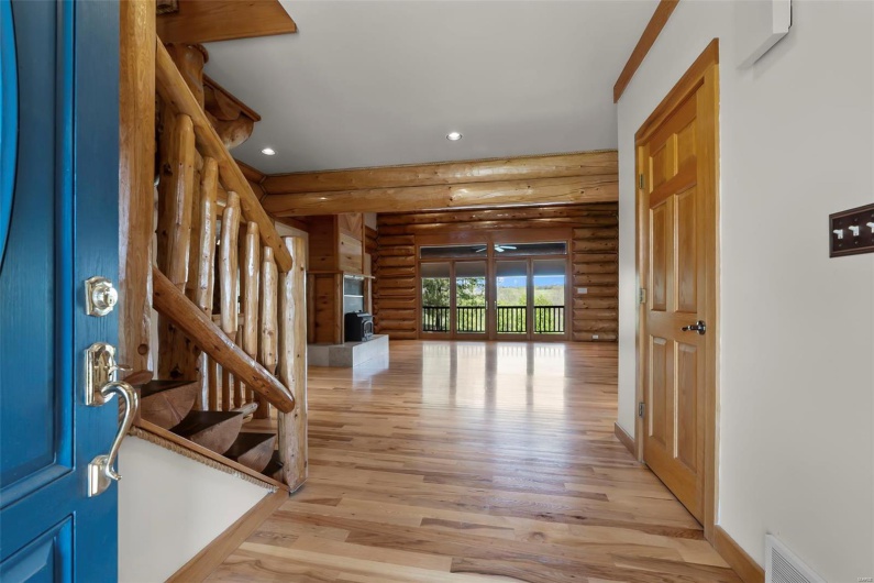 View through Great Room to Rear French Doors from Entry Foyer
