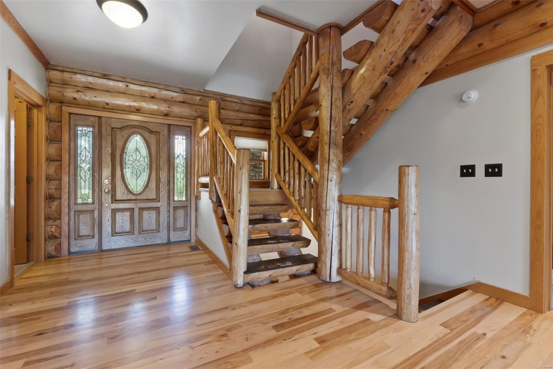 Foyer and Open Staircases Leading to Upper & Lower Levels