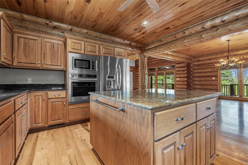 Modern Kitchen with Eat-At Bar, Granite Counter Tops, & Stainless Appliances