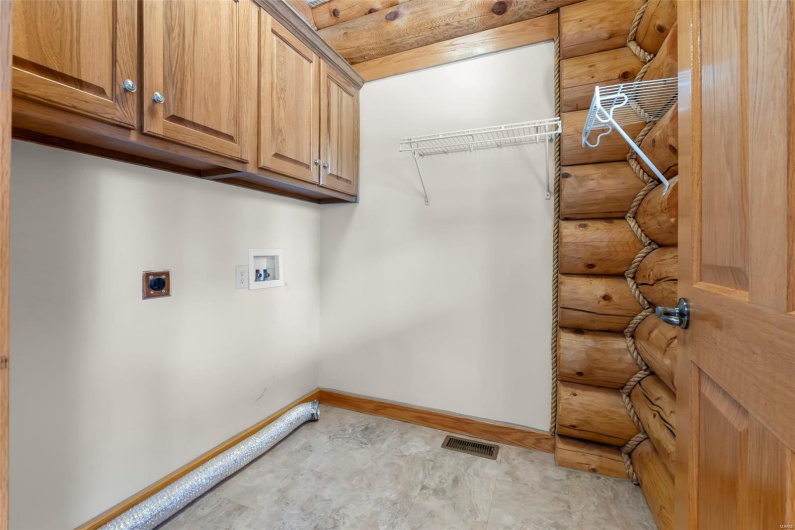 Main Level Laundry Room with Overhead Storage