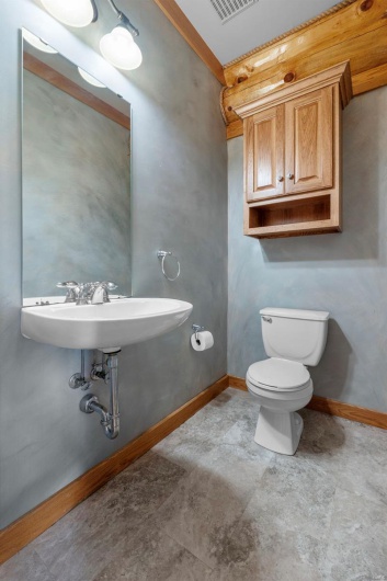 Main Level Half Bath Adjacent to Common Living Areas
